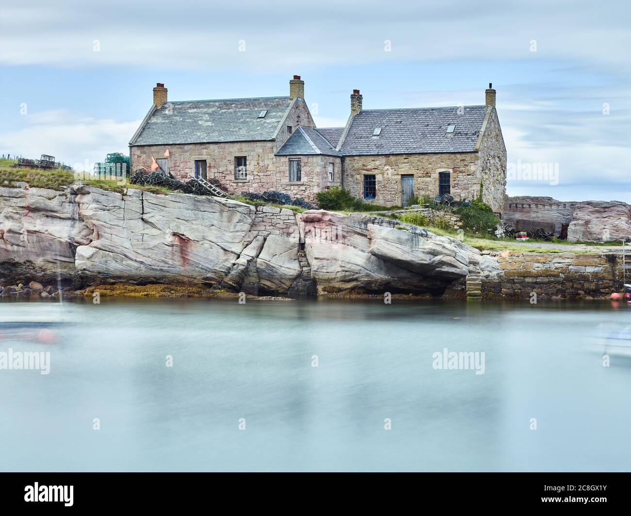 A Long Exposure photograph of Cove Harbour, Scottish Borders in the the