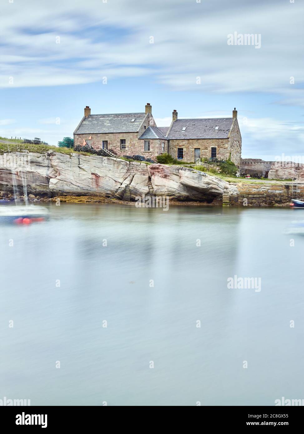 A Long Exposure photograph of Cove Harbour, Scottish Borders in the the