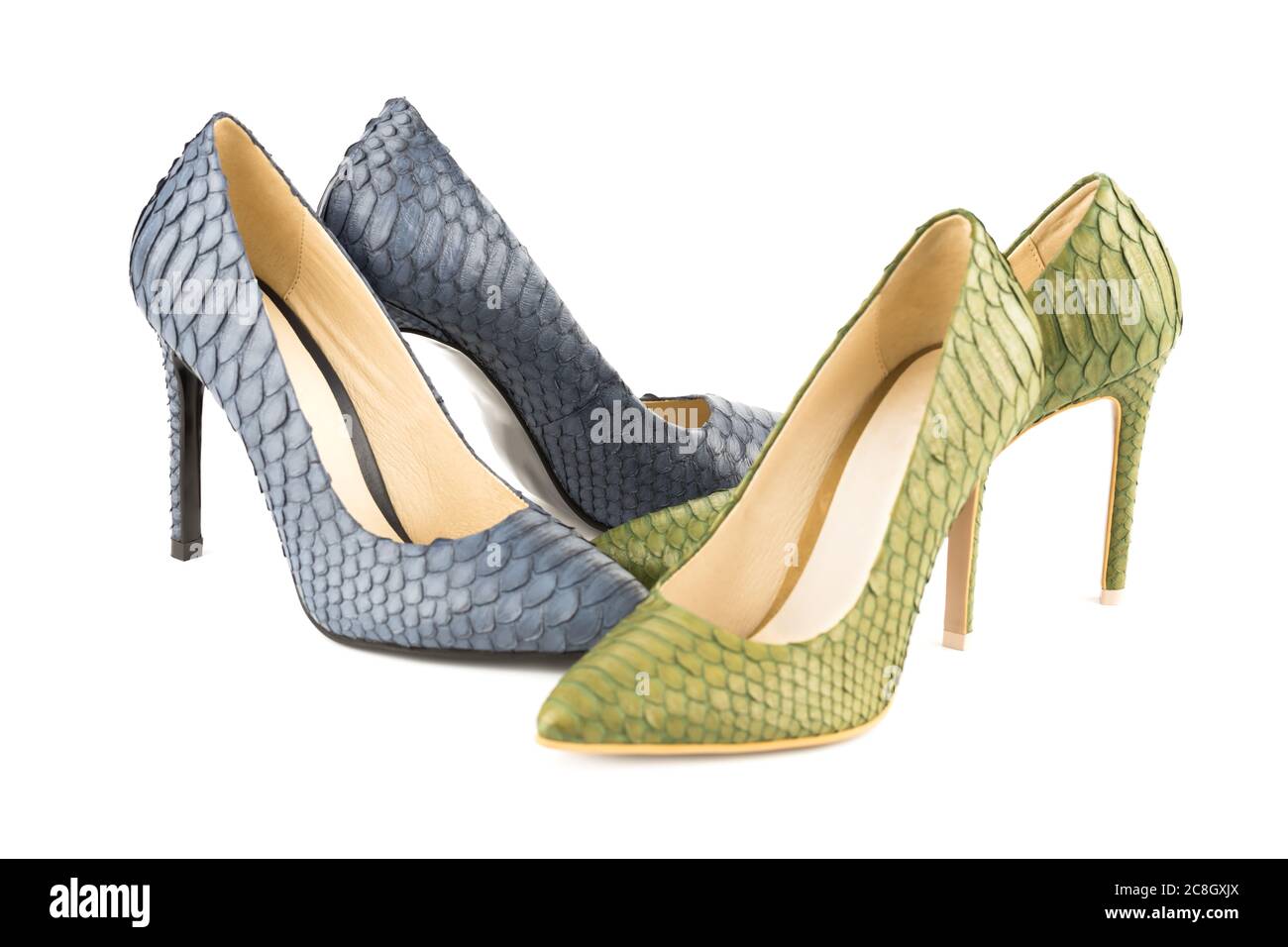 Two pairs of stylish high heels python leather shoes isolated on white ...