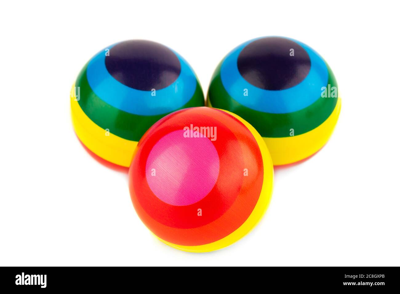 Three colorful striped rubber balls isolated on white background Stock