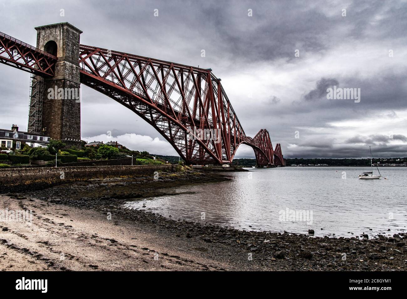 Edinburgh, SCOTLAND: Beautiful view of the railway bridge 'Firth of Forth'. The red bridge seen from the abandoned Albert Hotel Building. Stock Photo