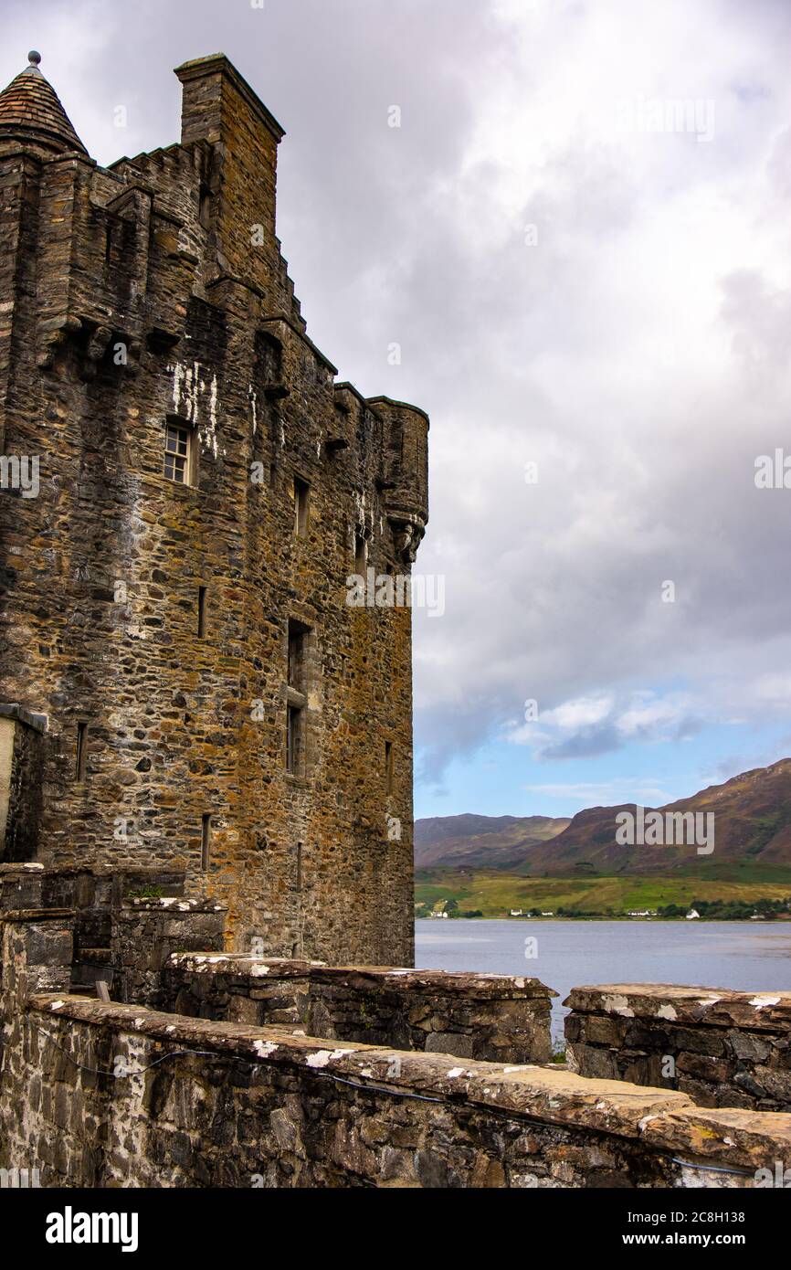 Dornie, SCOTLAND: Summer days with a blue sky above the beautiful Scottish castle of Eilean Donan in the middle of a lake. Stock Photo