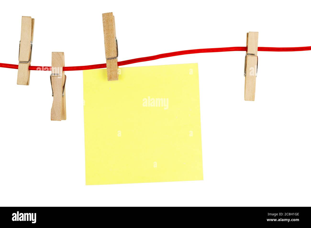 blank yellow note on clothesline isolated on white Stock Photo - Alamy