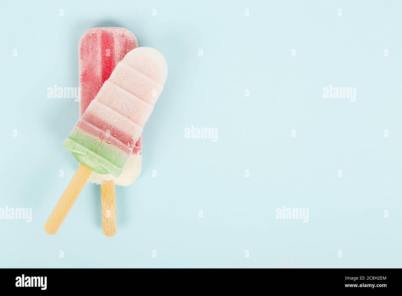 closeup of popsicles on cyan surface Stock Photo