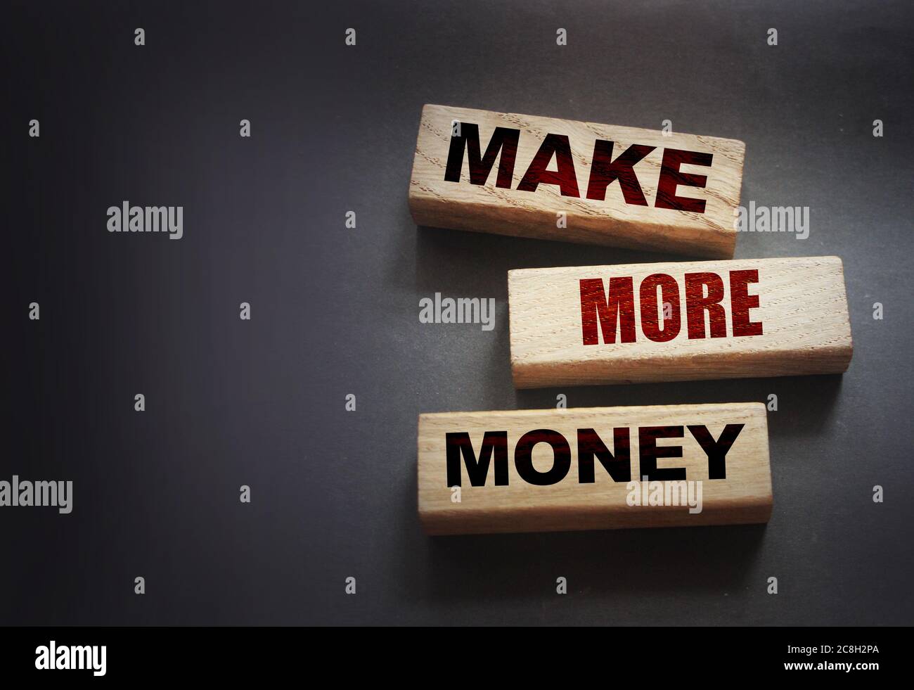 Wooden Blocks with the text Make more Money. Business or Career concept Stock Photo