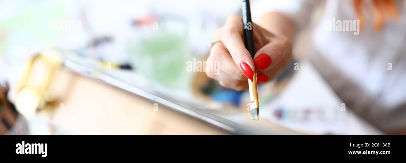 Female hand with red nails Stock Photo