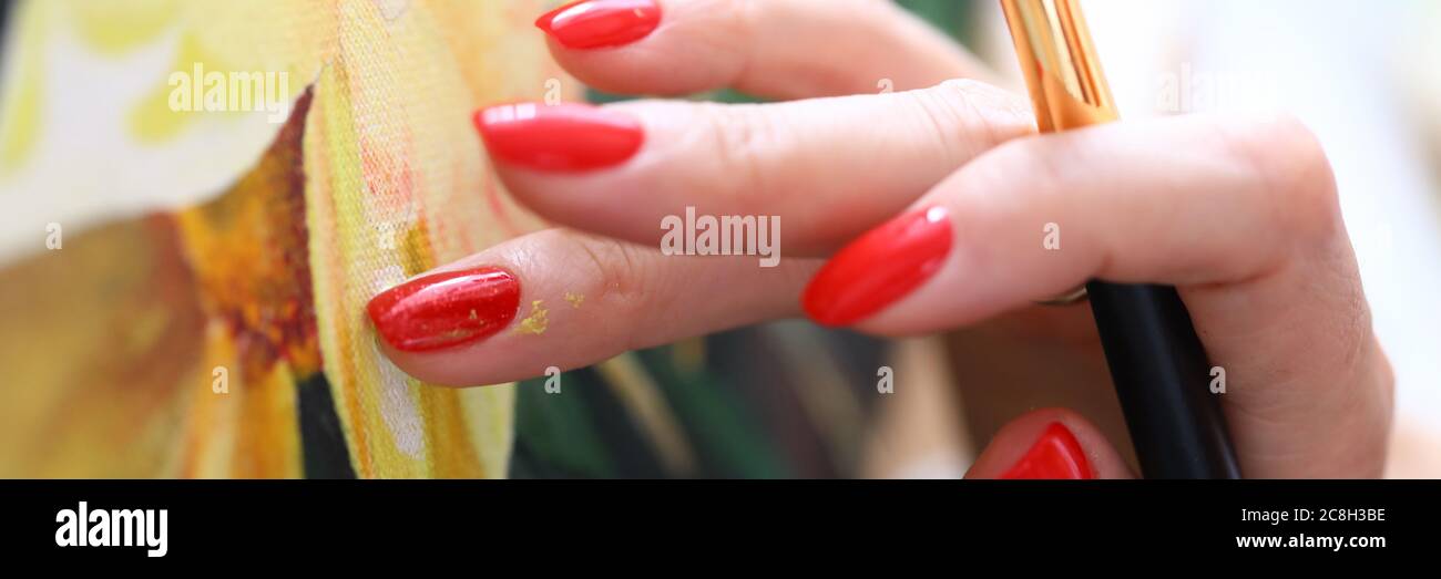 Talented woman with red nails Stock Photo