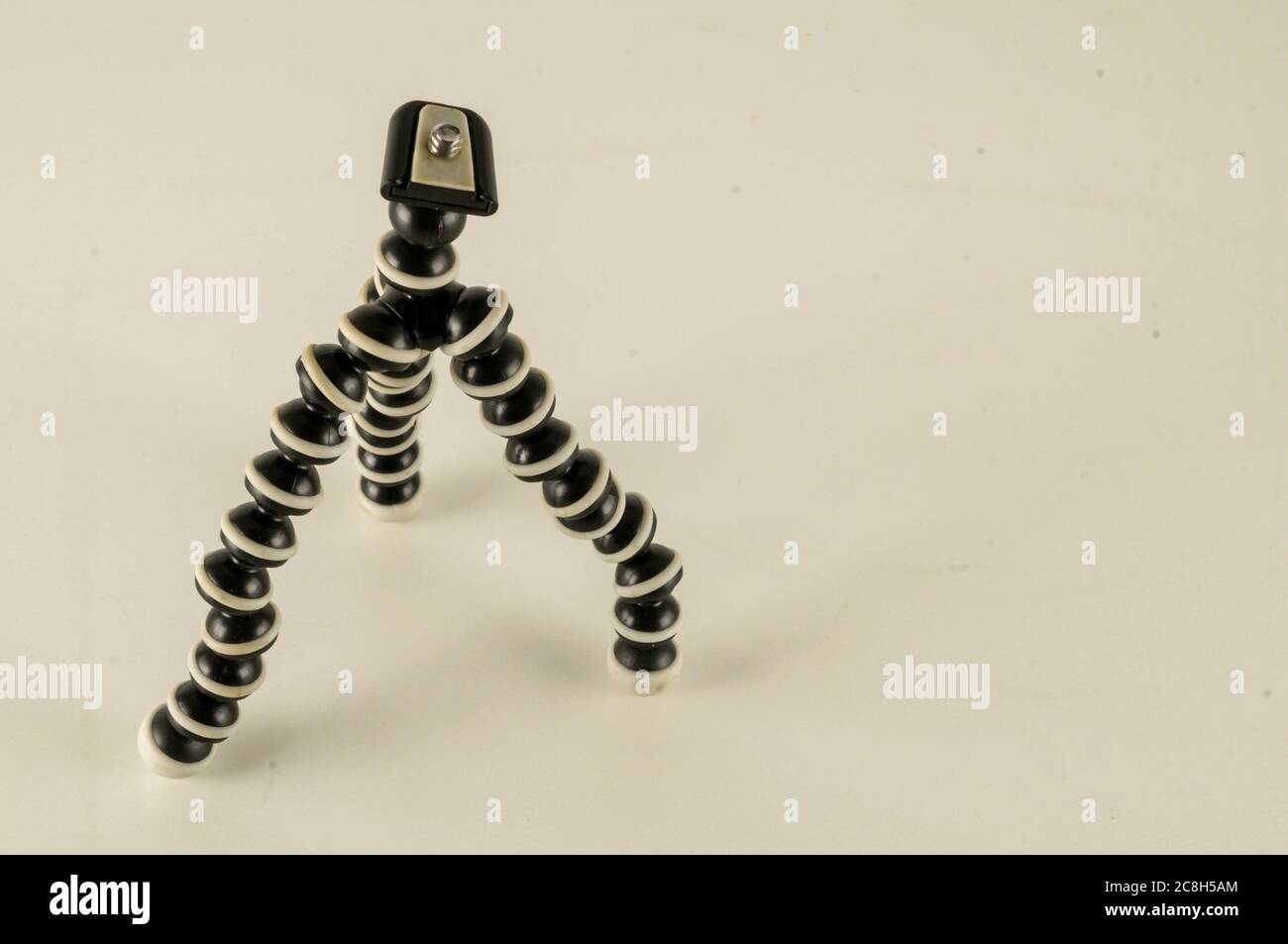 Mini table flexible tripod on white background Stock Photo