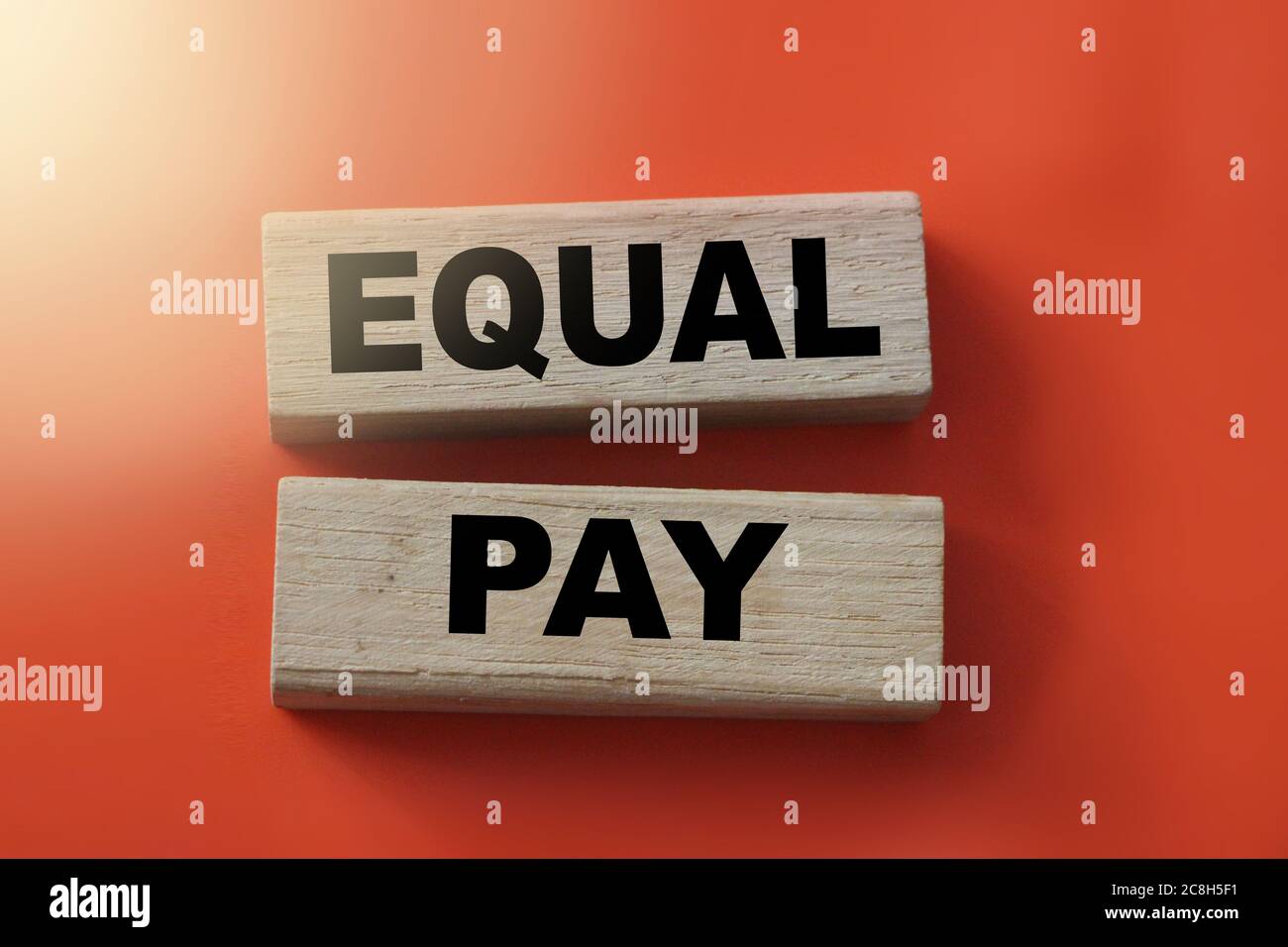 Equal pay words on wooden blocks. No Income differences concept Stock Photo