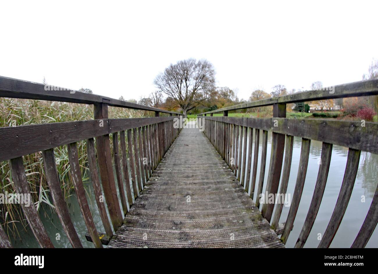An old wooden bridge taken with a fish eye lens, giving a distorted effect Stock Photo