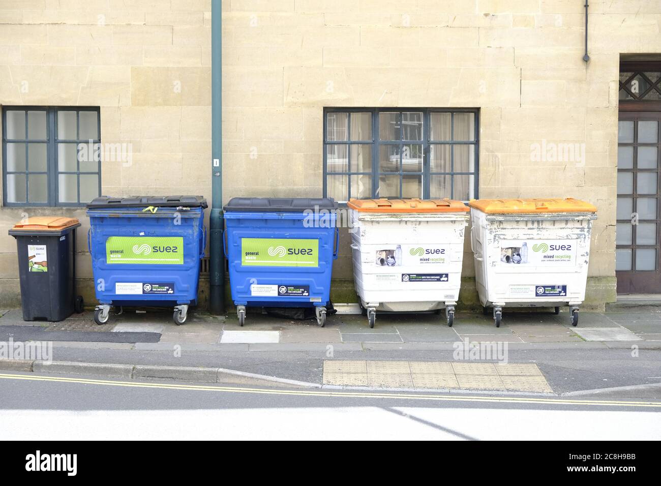 Commercial, general waste and recycling bins outside a commercial