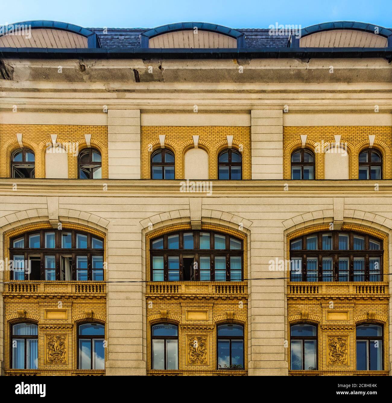 Hungary, Budapest, Aug 2019, close up of a facade of a yellow building Stock Photo