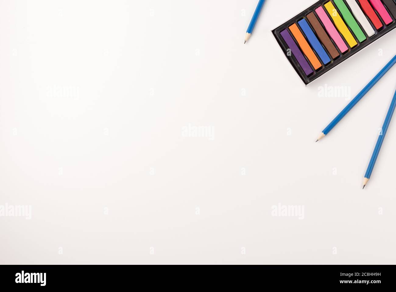 Colorful wax crayons and pencils isolated on white background. Copy ...