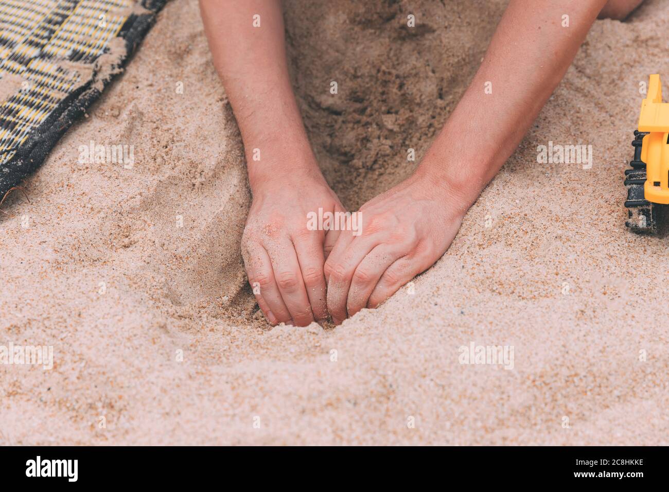 Playing dig digging hole hi-res stock photography and images - Alamy