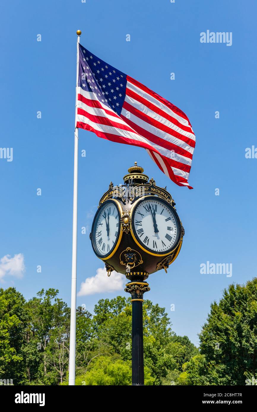 Mooresville, NC, USA: Clock and American Flag at the Trump National Golf Club Charlotte Stock Photo