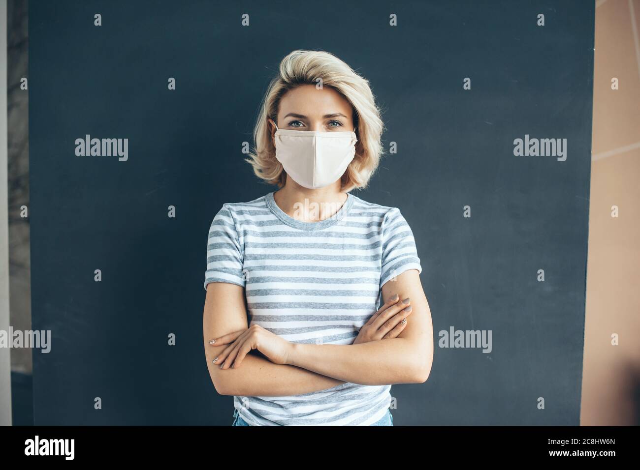Front view photo of a caucasian woman with medical mask on face posing ...