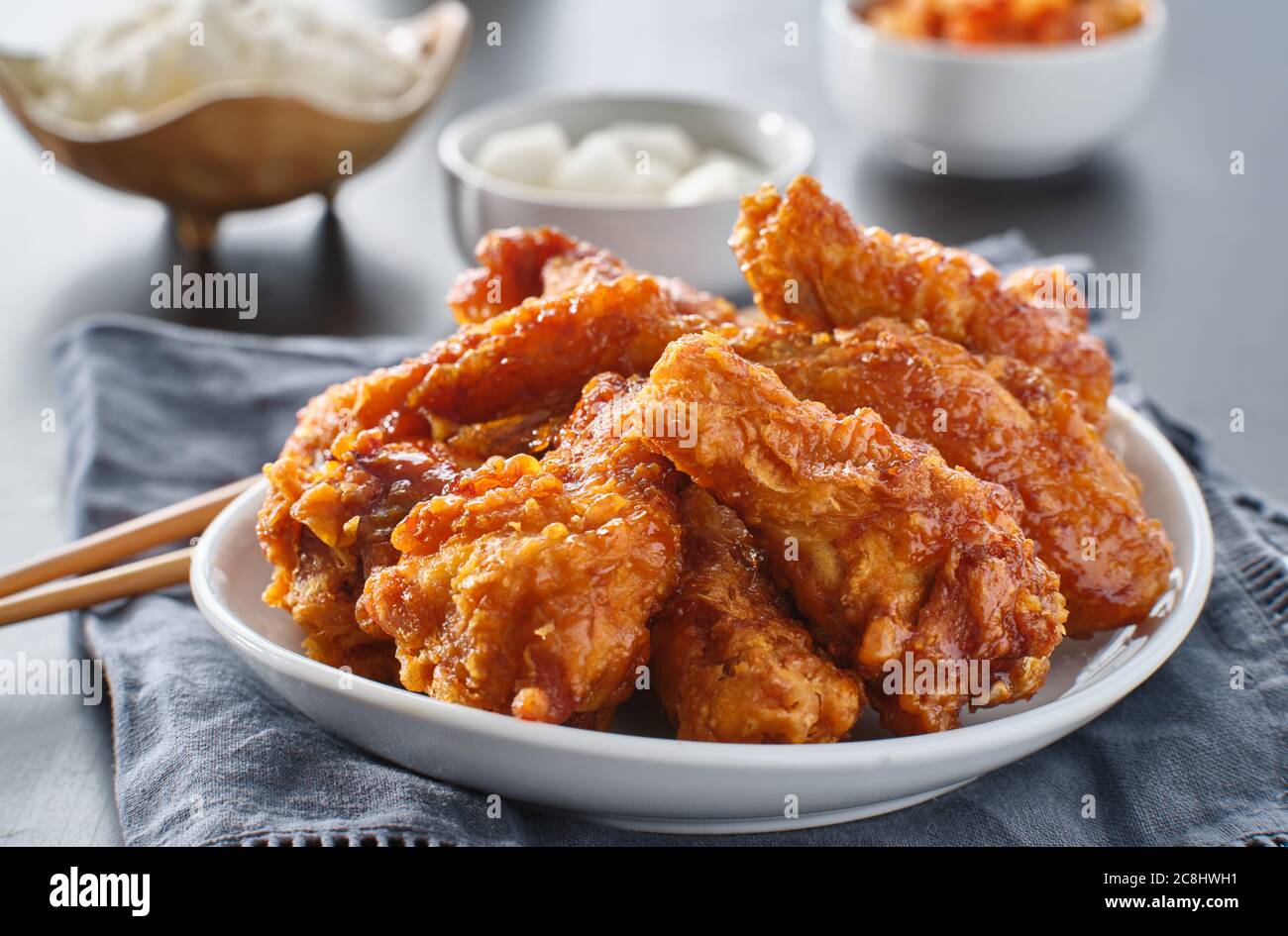 crispy fried korean chicken wings in soy garlic sauce with pickled
