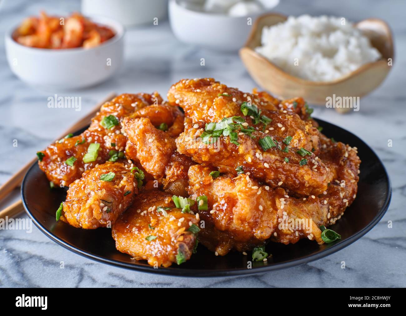 crispy fried korean chicken wings in galbi sauce with pickled radish
