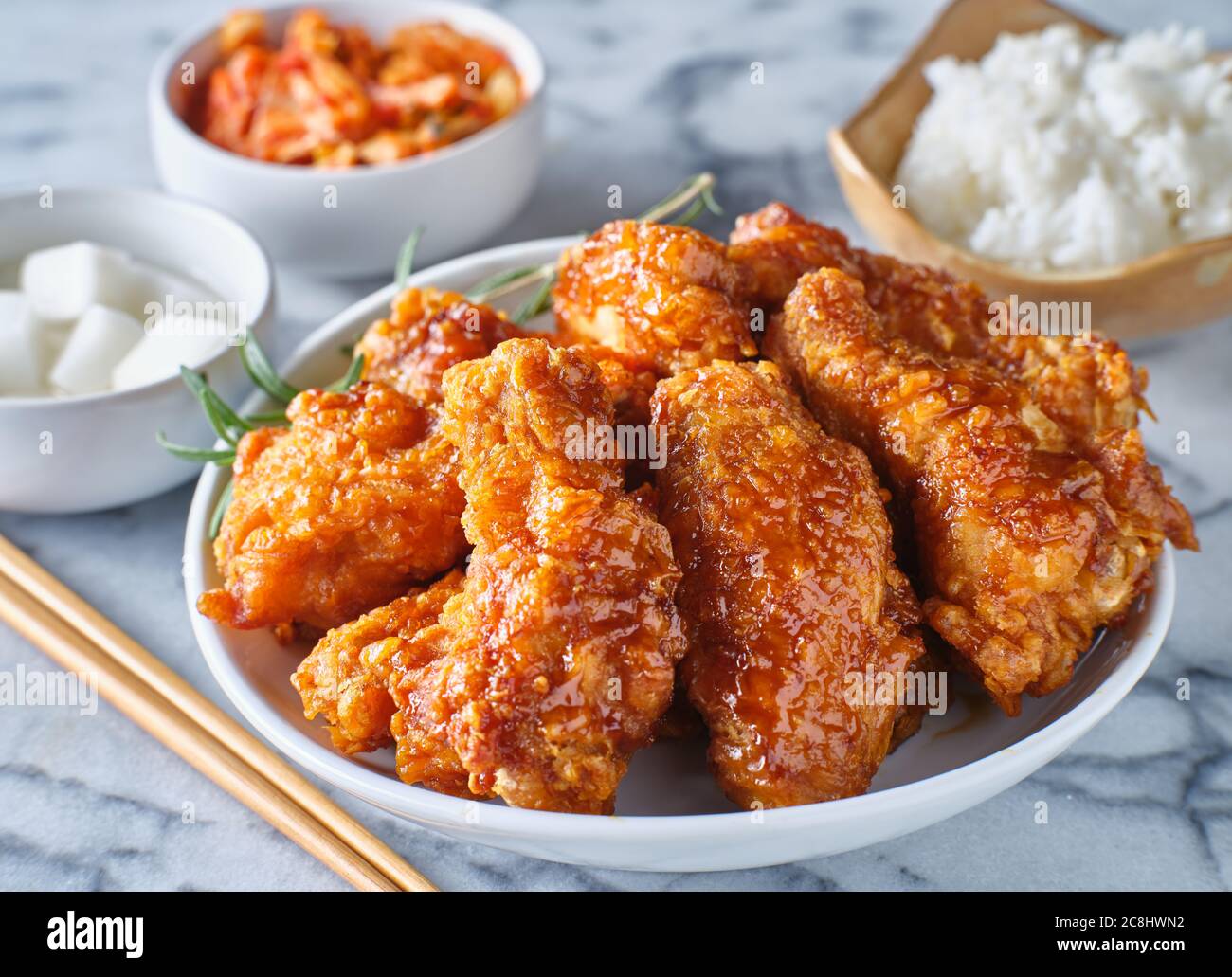 crispy fried korean chicken wings in soy garlic sauce with pickled