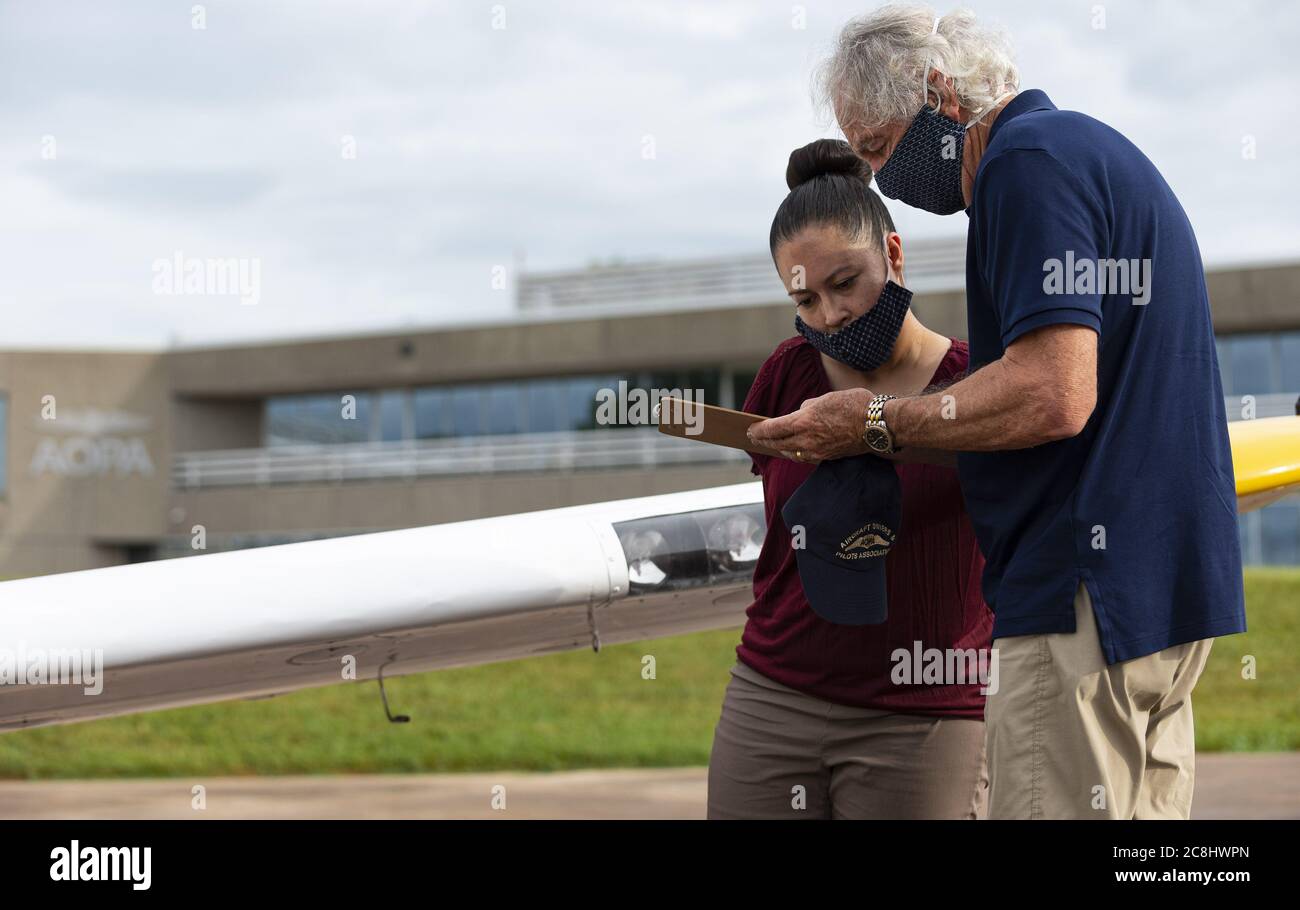 Frederick, United States. 24th July, 2020. Pilot Jessica Cox, who was born without arms and uses her feet and toes in place of hands, preflights her single-engine Ercoupe aircraft with fellow pilot and former Sen. Tom Harkin, D-Iowa, in Frederick, Maryland, Friday, July 24, 2020. Photo by David Tulis/UPI. Credit: UPI/Alamy Live News Stock Photo