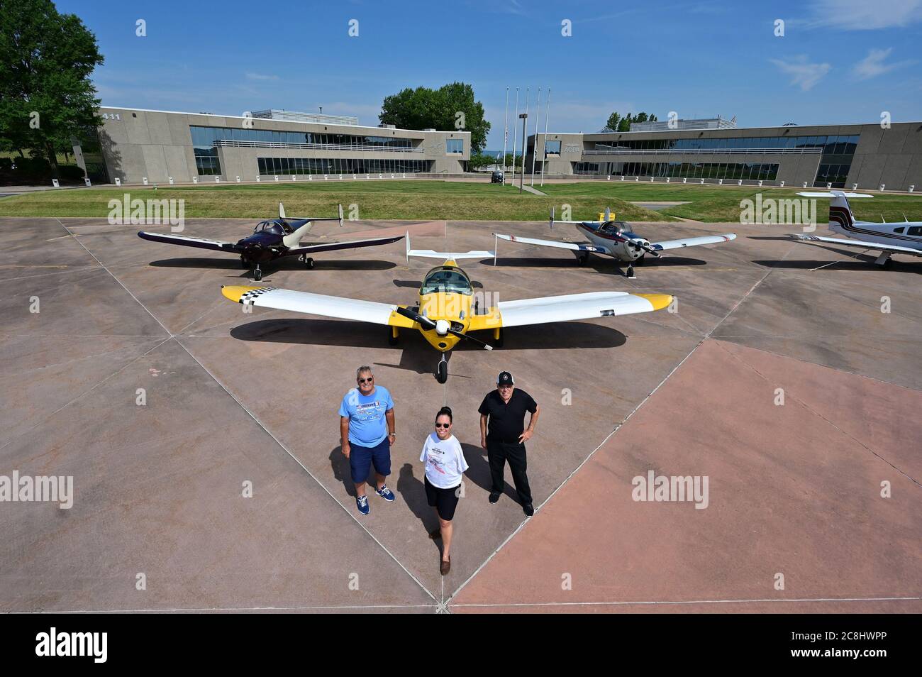 Frederick, United States. 24th July, 2020. American with Disabilities Act advocate and pilot Jessica Cox, who was born without arms and flies a two-seat Ercoupe airplane manufactured with linked aileron and rudder controls, poses for a portrait with fellow Ercoupe pilots R. Lee Townsend, right, and Joe Novotny during a visit to the Aircraft Owners and Pilots Association at Frederick Municipal Airport in Frederick, Maryland, Wednesday, July 22, 2020. Credit: UPI/Alamy Live News Stock Photo