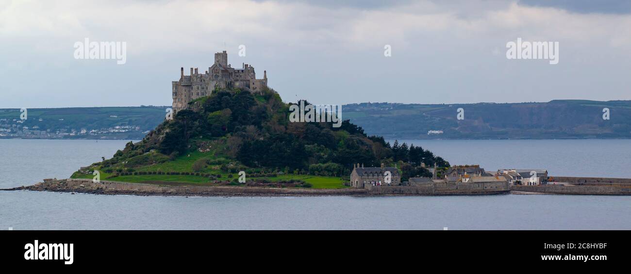 Landscape panorama of the Mouth's bay featuring St Michael's Mount in the middle. This is a tidal island connected to mainland through a man made gran Stock Photo