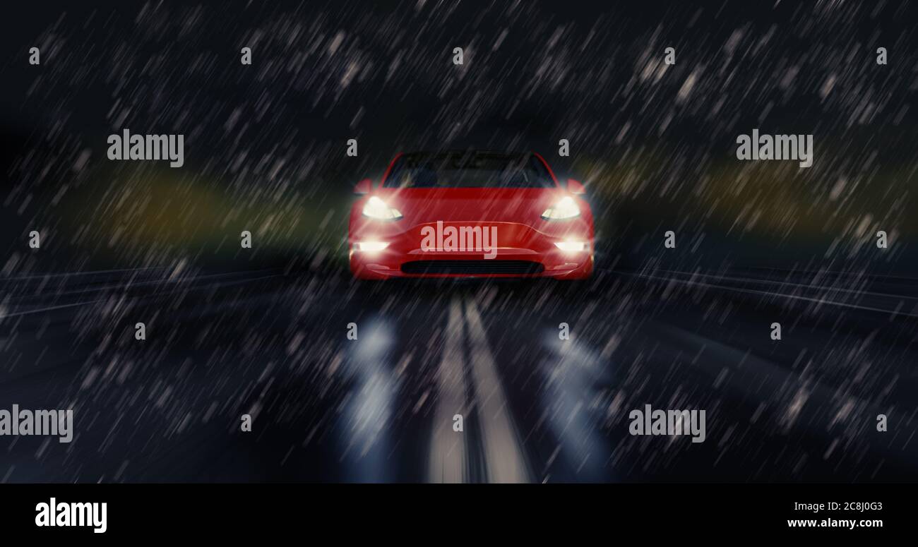 Red sports car drives fast through the rainy night, safety saisonal weather tire concept Stock Photo