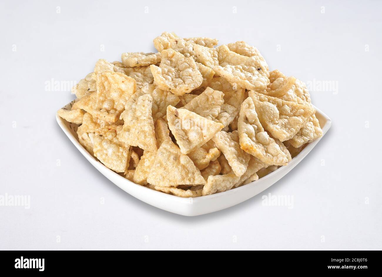 Deep fried Khichiya Papad, Traditional Indian Snacks, Indian crunchy fried snack papad or Papadam made of rice floor served in a plate. Also known as Stock Photo