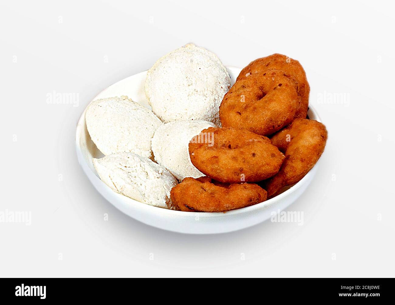Group of South Indian food like Paper Masala Dosa (dhosa), Idli or idly, Wada or vada (Medu Vada), sambhar, sambar and coconut chutney, white backgrou Stock Photo