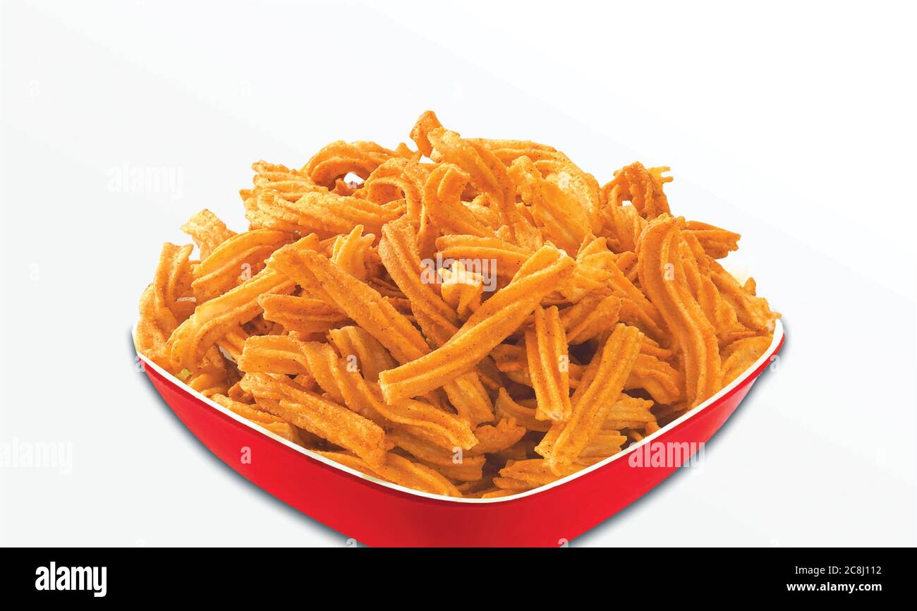 Fried and Spicy sweet Soya Sticks, Soya Bean, cheese sticks, is a very popular Gujarati snack, white bowl, pouch packing common street snack from Indi Stock Photo