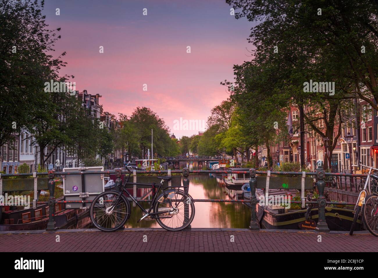 Dusk over a canal in Amsterdam Stock Photo