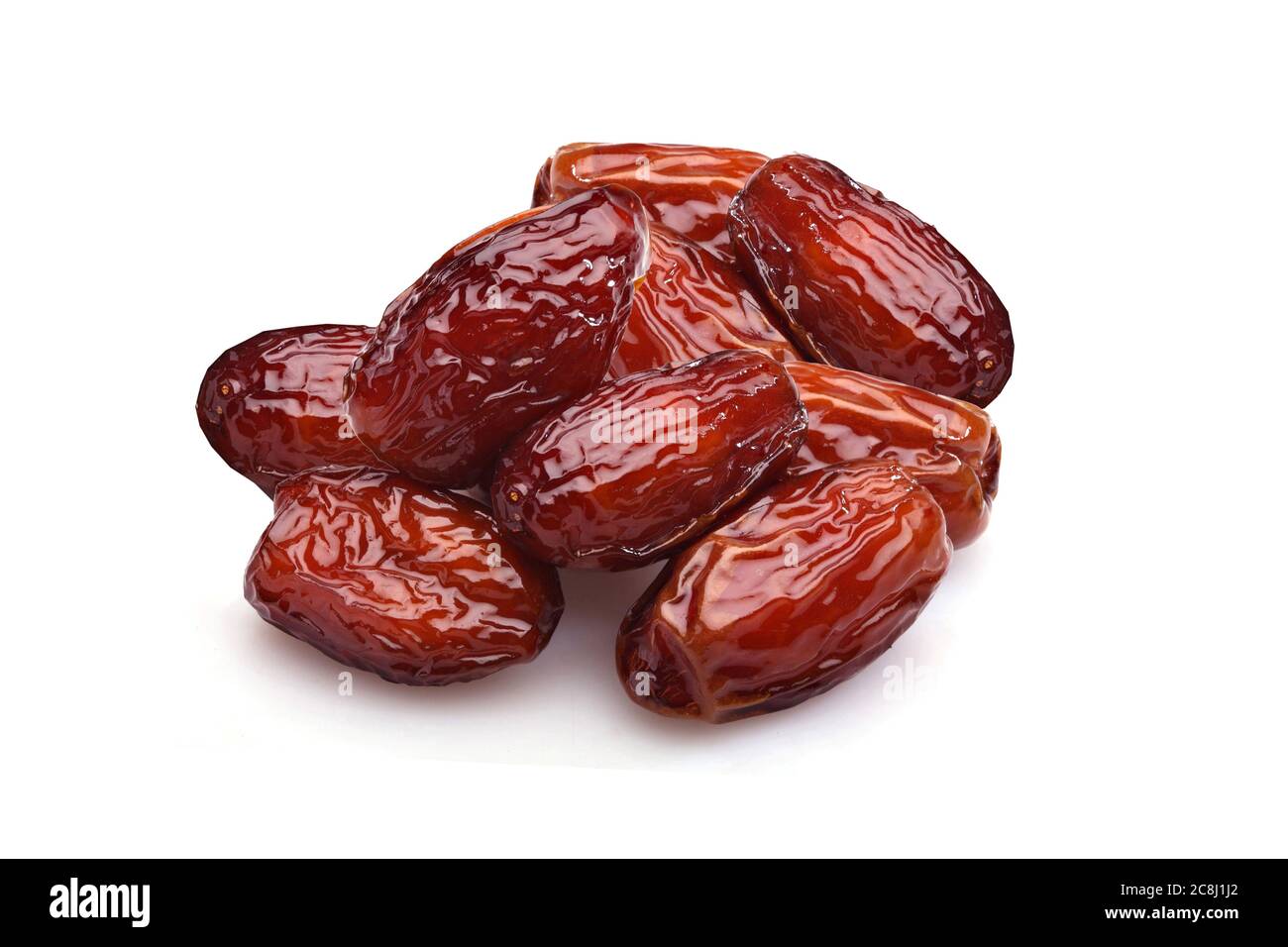 Bowl of pitted Sweet dried dates fruit isolated on white background. - Image Stock Photo