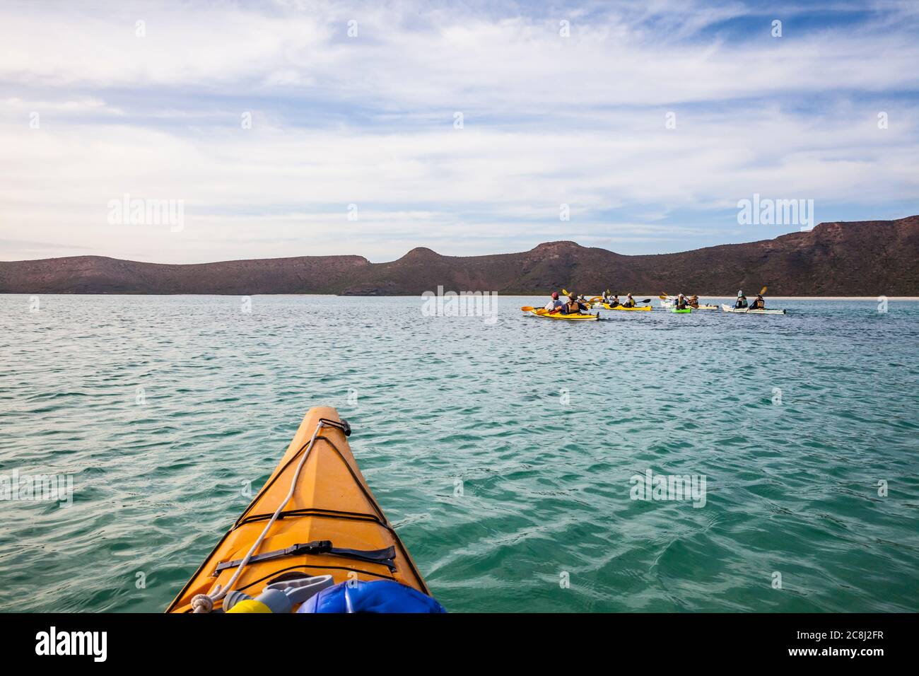 A guided sea kayaking tour offshore paddling in a lagoon off Isla Espirito Santo, Gulf of California, BCS, Mexico. Stock Photo