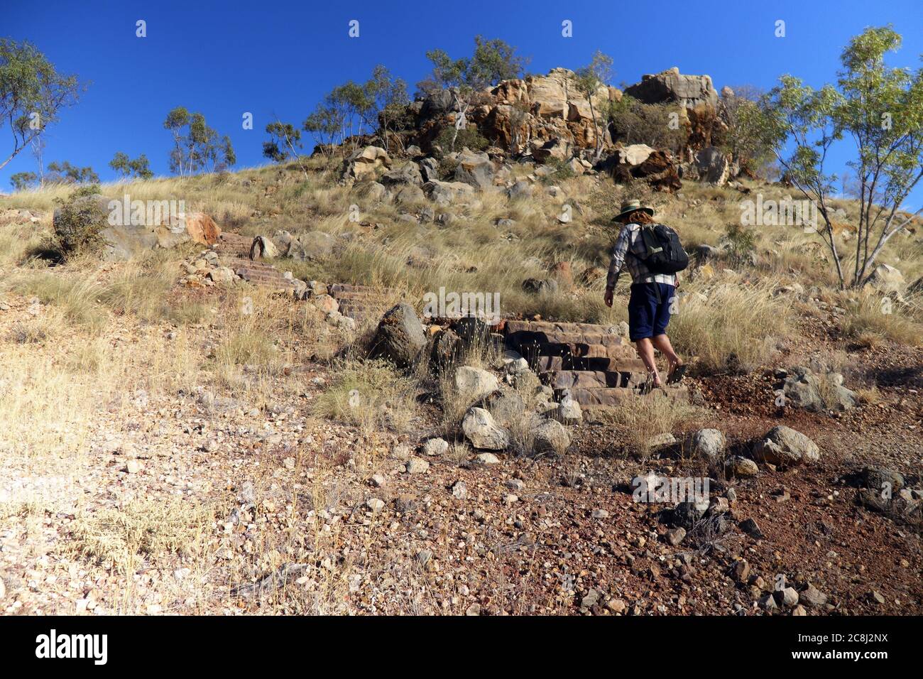 Person walking up to Riversleigh Site D, Riversleigh fossils World Heritage Area, outback Queensland, Australia. No MR Stock Photo