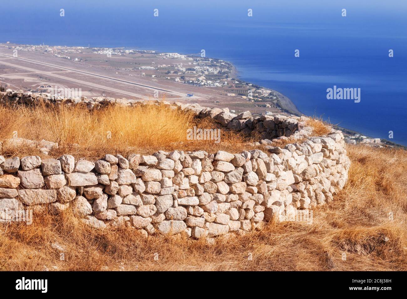 Ancient Thera ruins overlooking Santorini airport Stock Photo