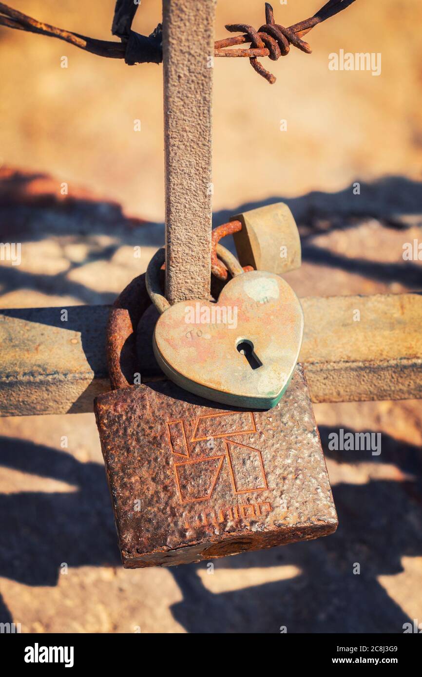 Love padlock on the railing of the old castle in Oia, Santorini Stock ...