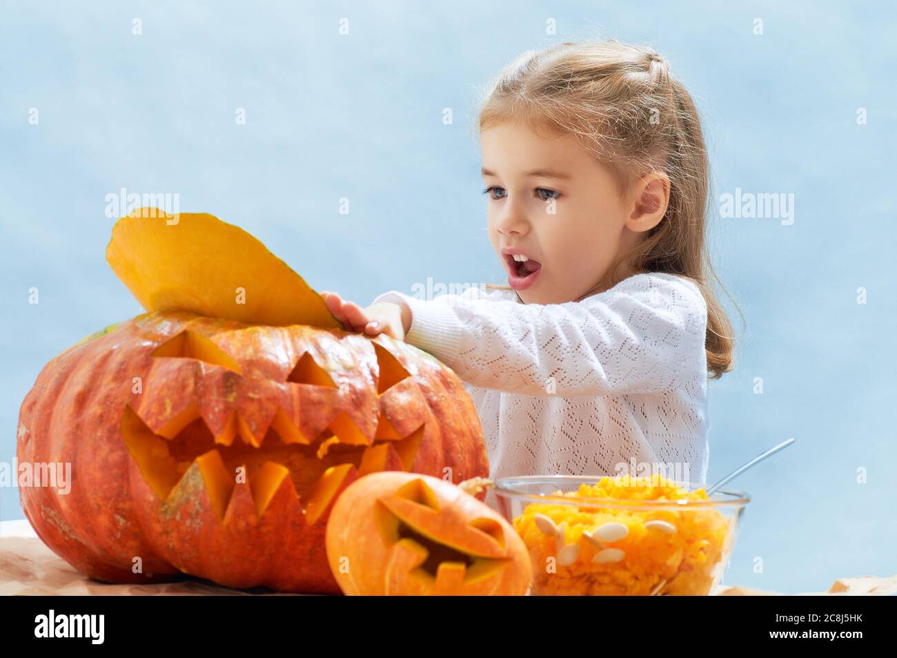 little girl holding a pumpkin Stock Photo - Alamy