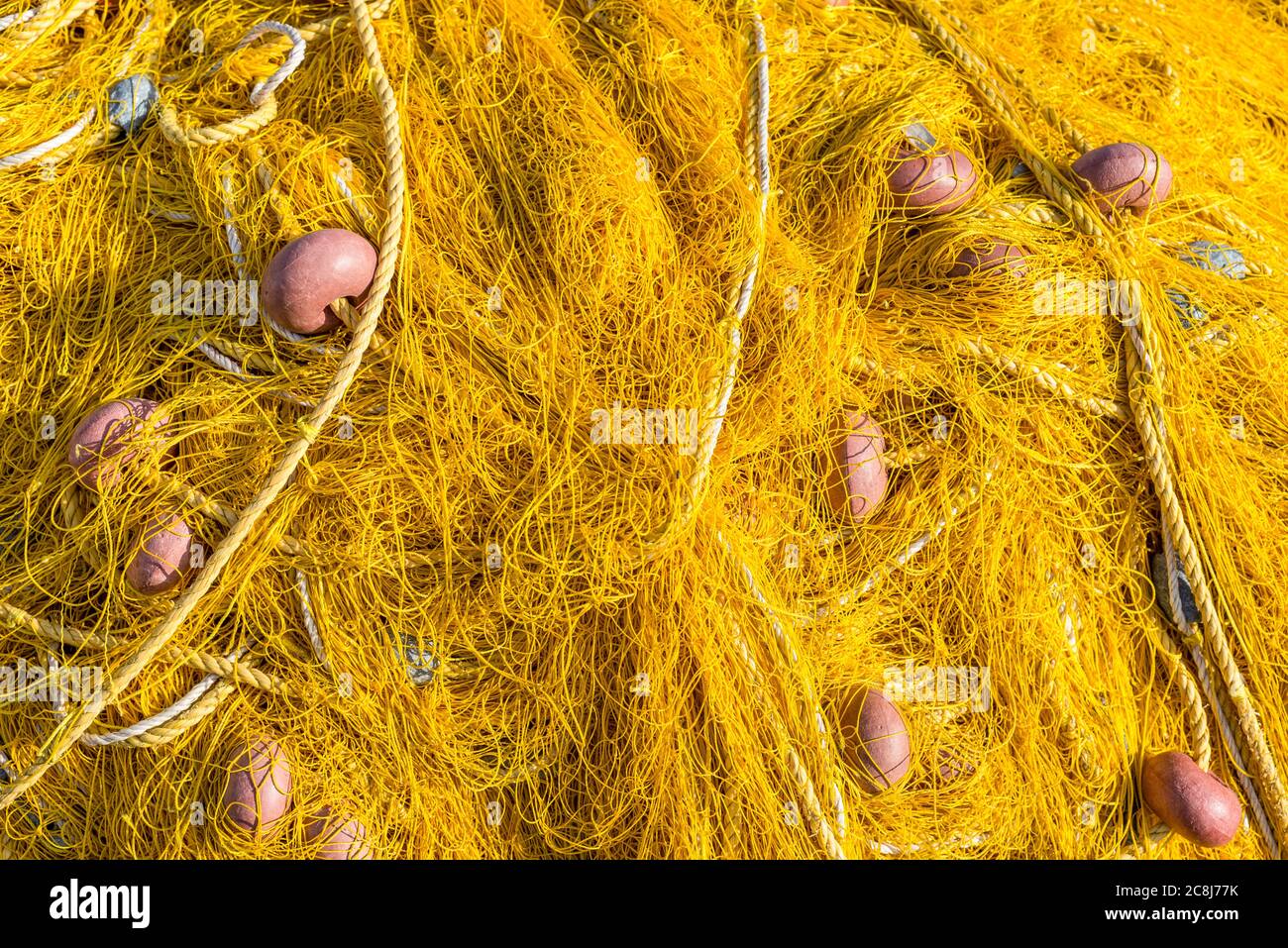 String of fishing net floats hi-res stock photography and images
