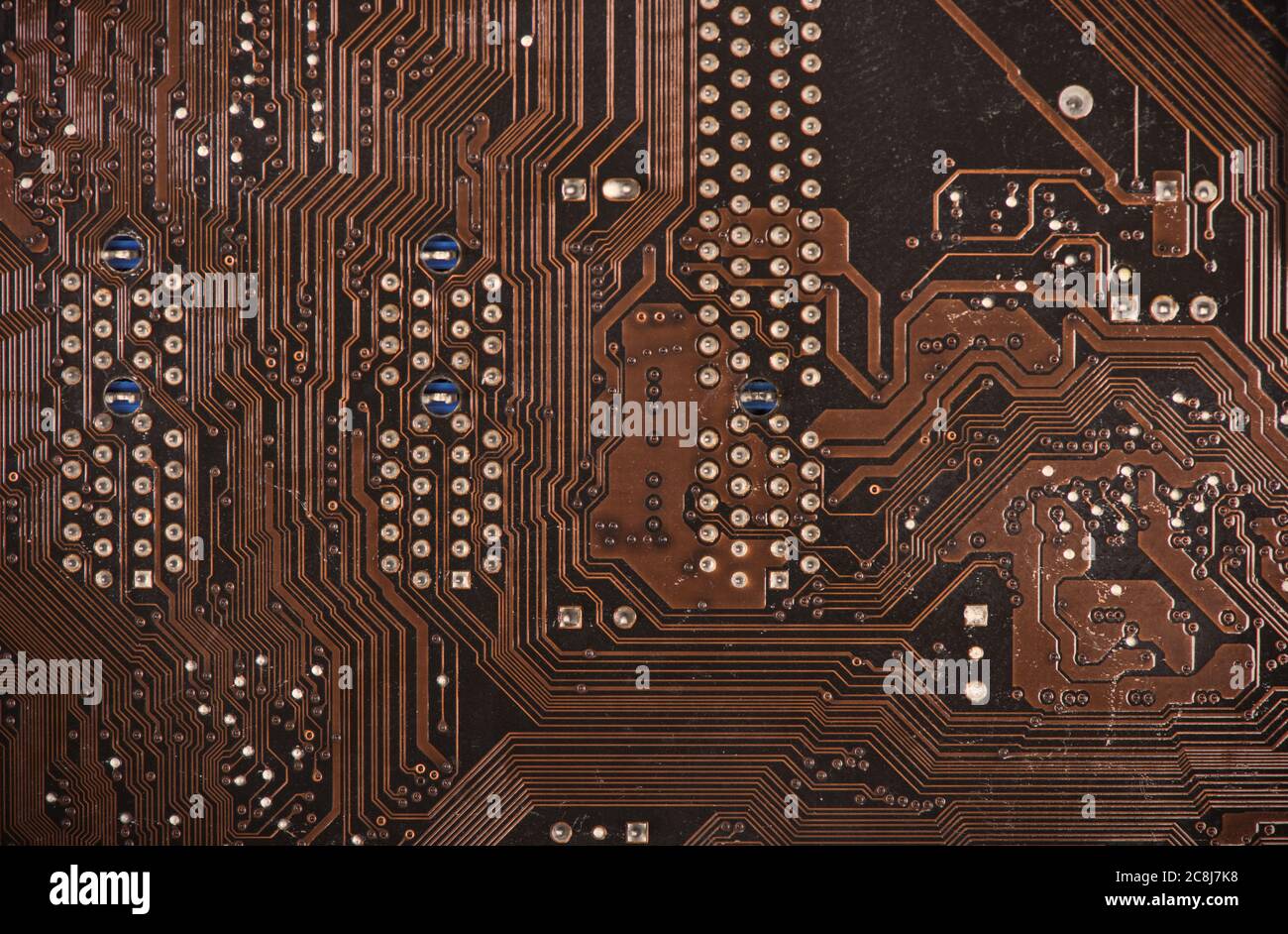 Modern printed brown circuit board, electronic circuit board, textolite. Background banner. Stock Photo