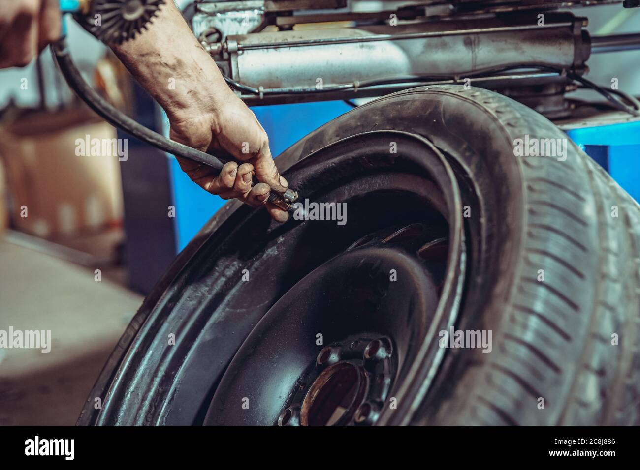 inflation of car tires with compressed air Stock Photo Alamy