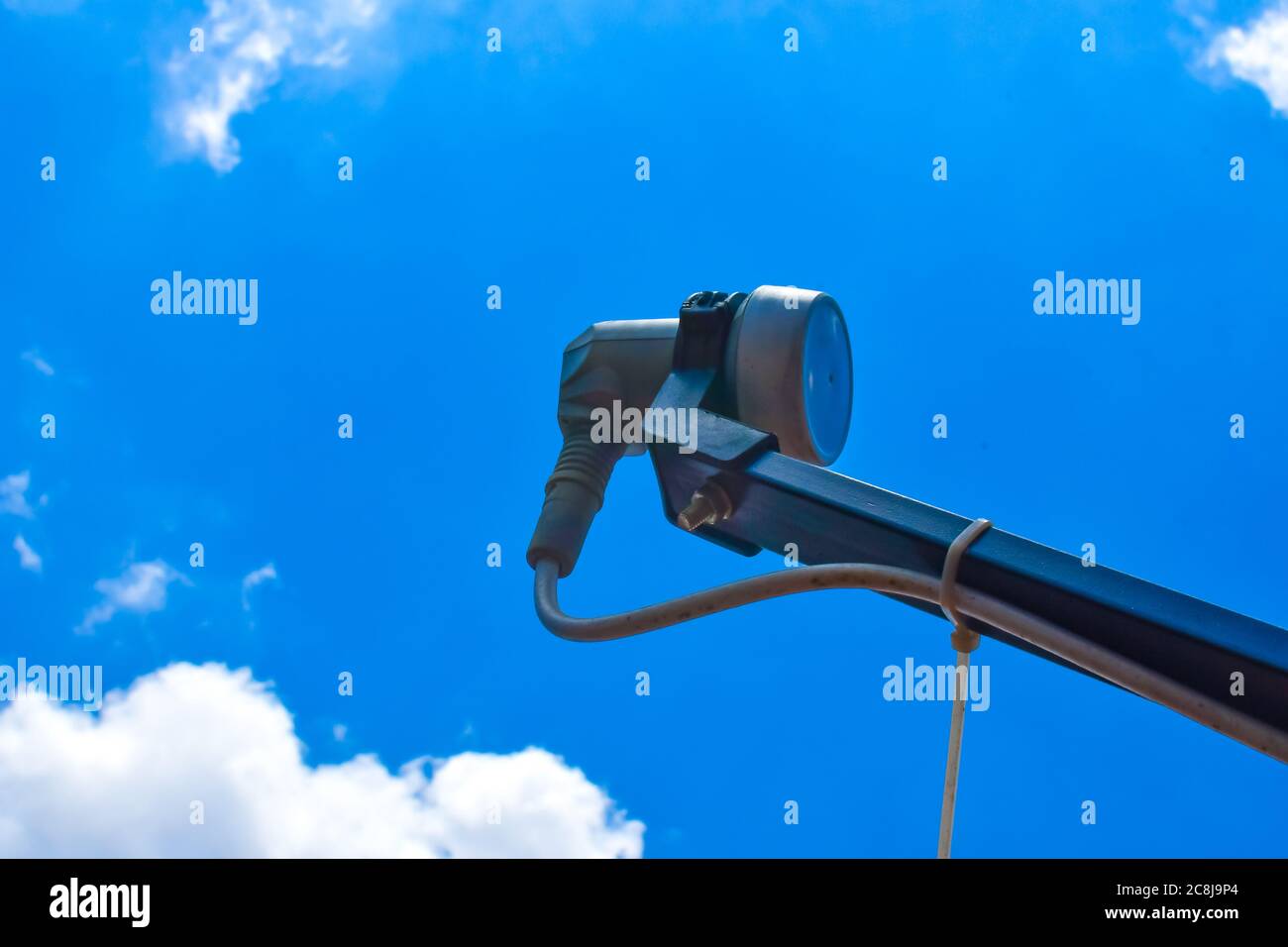 Satellite Receiver LNB On Blue Sky Background. Stock Photo