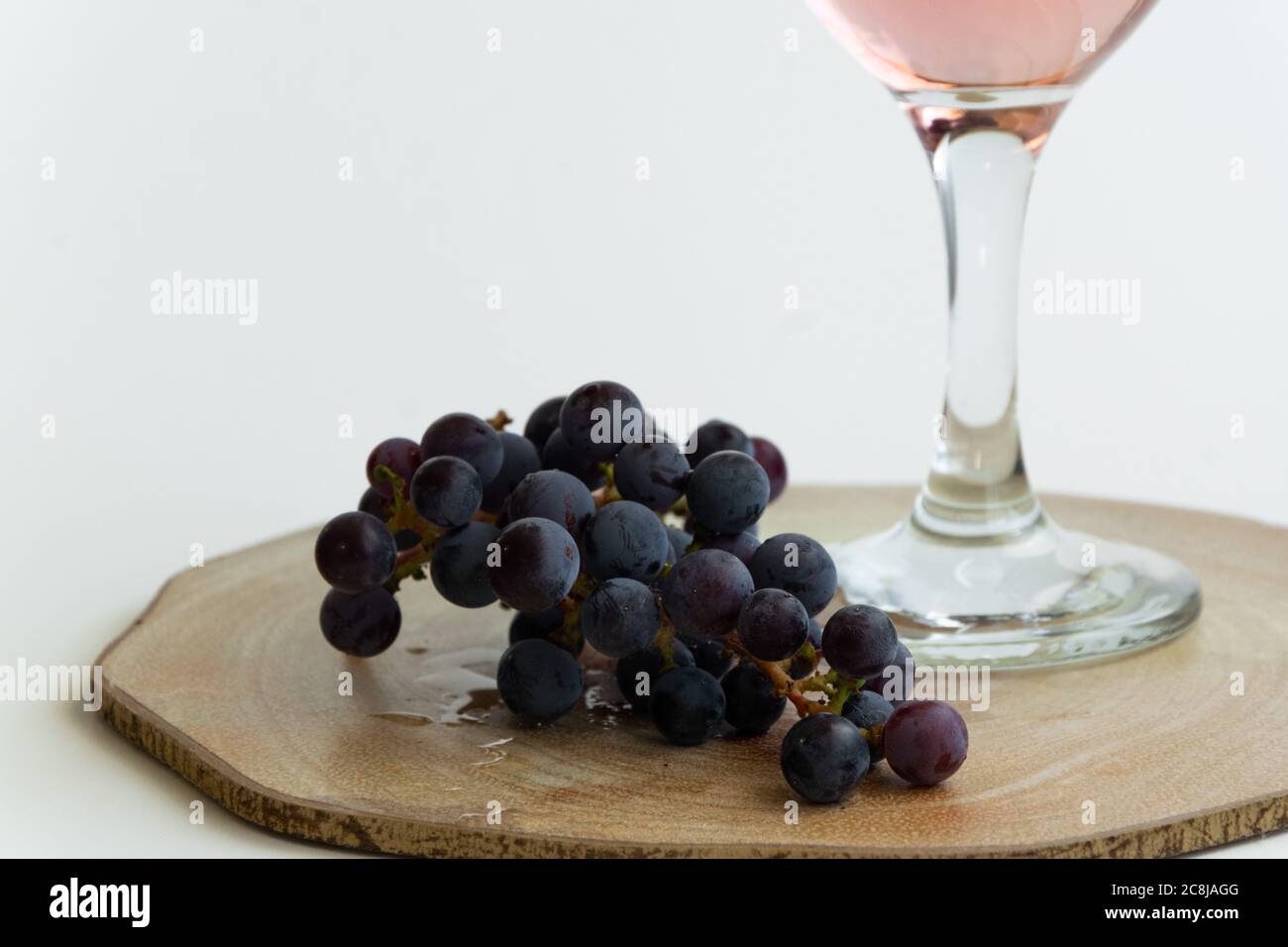 Isolated grape and wine. Alcoholic beverage product, space for text Stock Photo