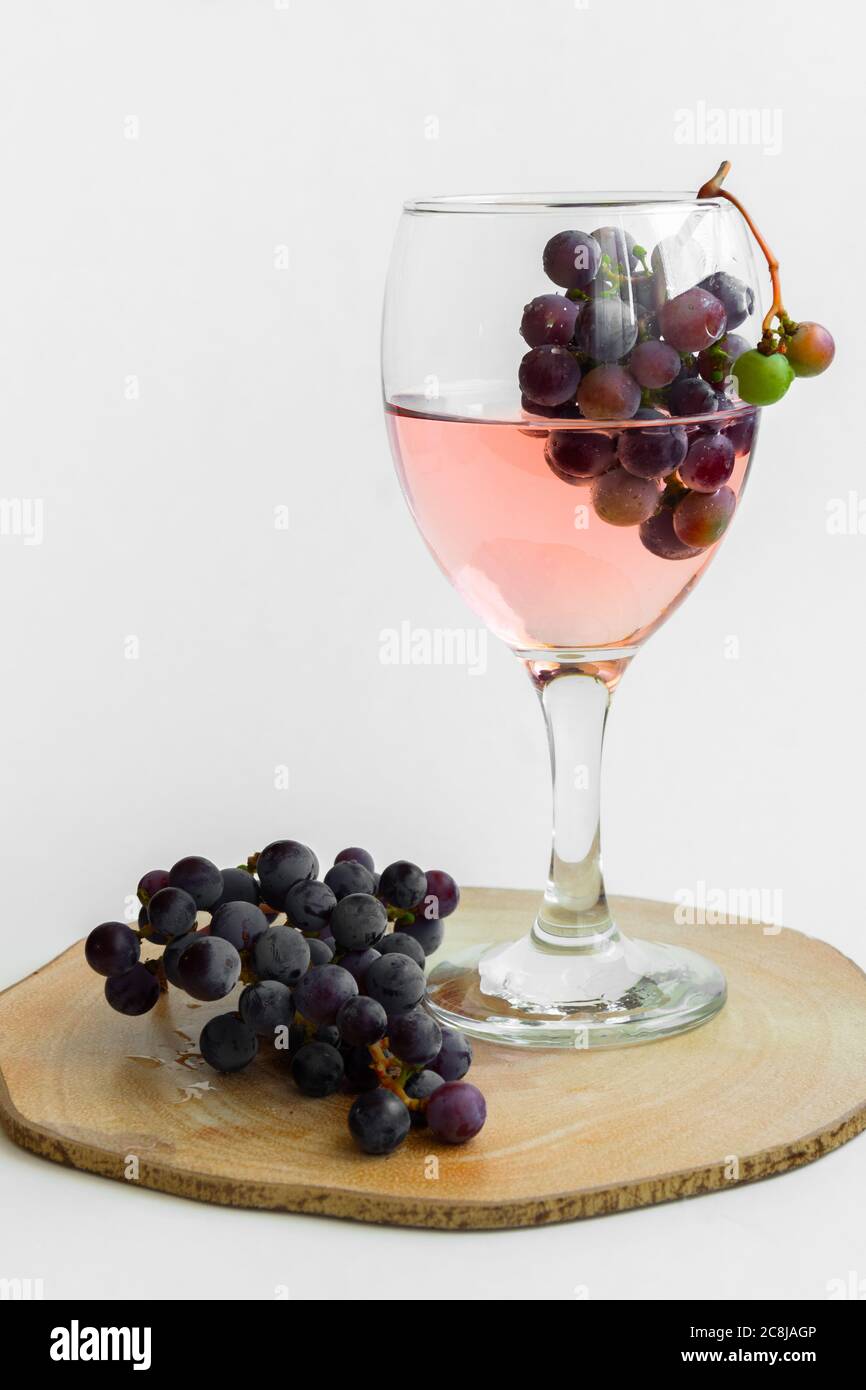 Isolated grape and wine. Alcoholic beverage product, space for text Stock Photo