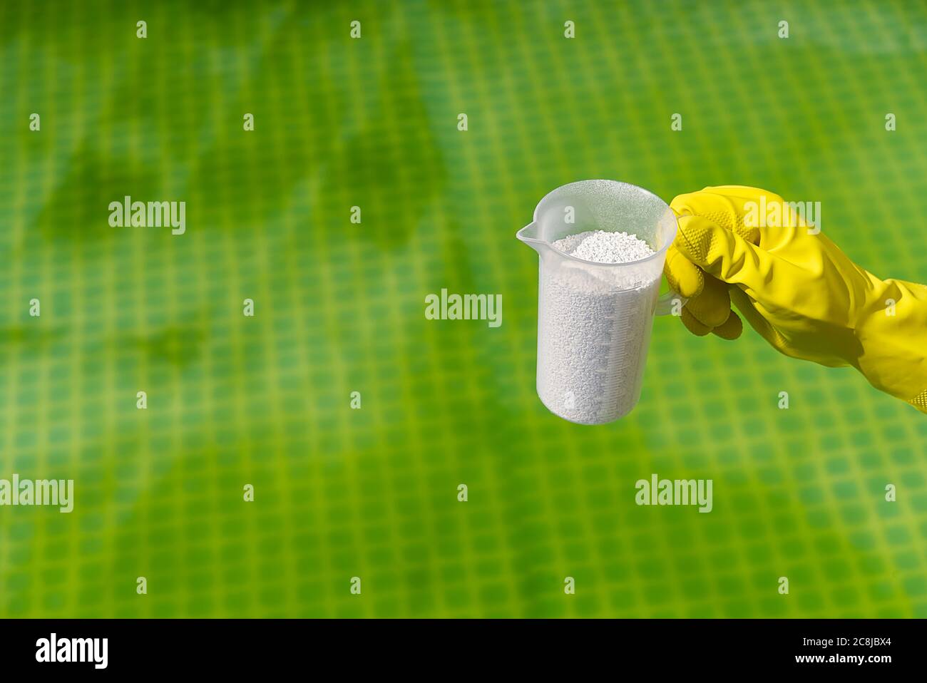 addition of chlorine powder for the pool to remove algae and disinfect