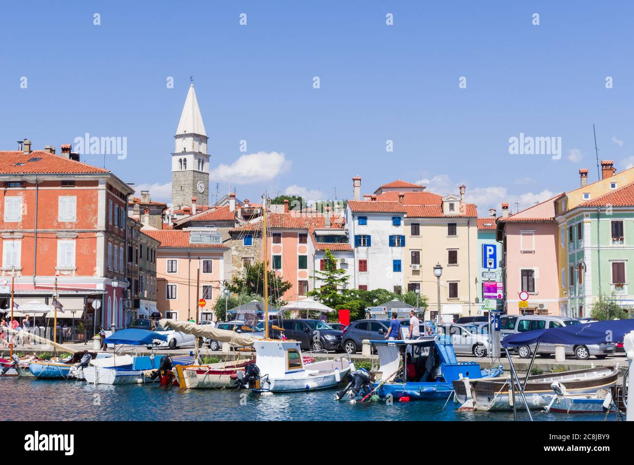 Izola, Slovenia (23rd July 2020) - The harbour of Izola with its colourful old houses and the bell tower of the dome Stock Photo