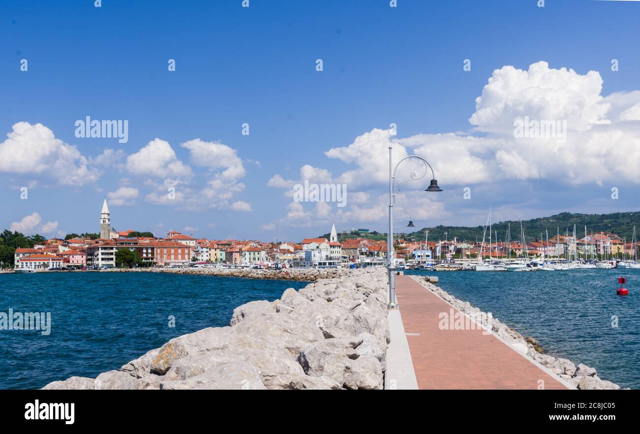 Izola, Slovenia (23rd July 2020) - View of the town of Izola from the walk along the port of the istrian town Stock Photo