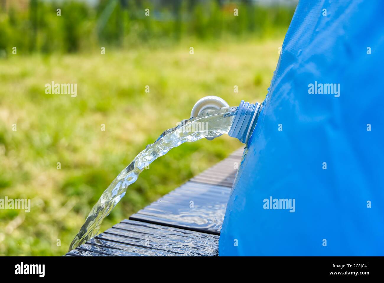 Drainage of water from an outdoor inflatable swimming pool. inflatable