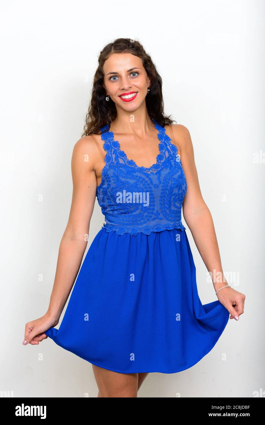 Portrait of young beautiful woman with curly hair Stock Photo - Alamy