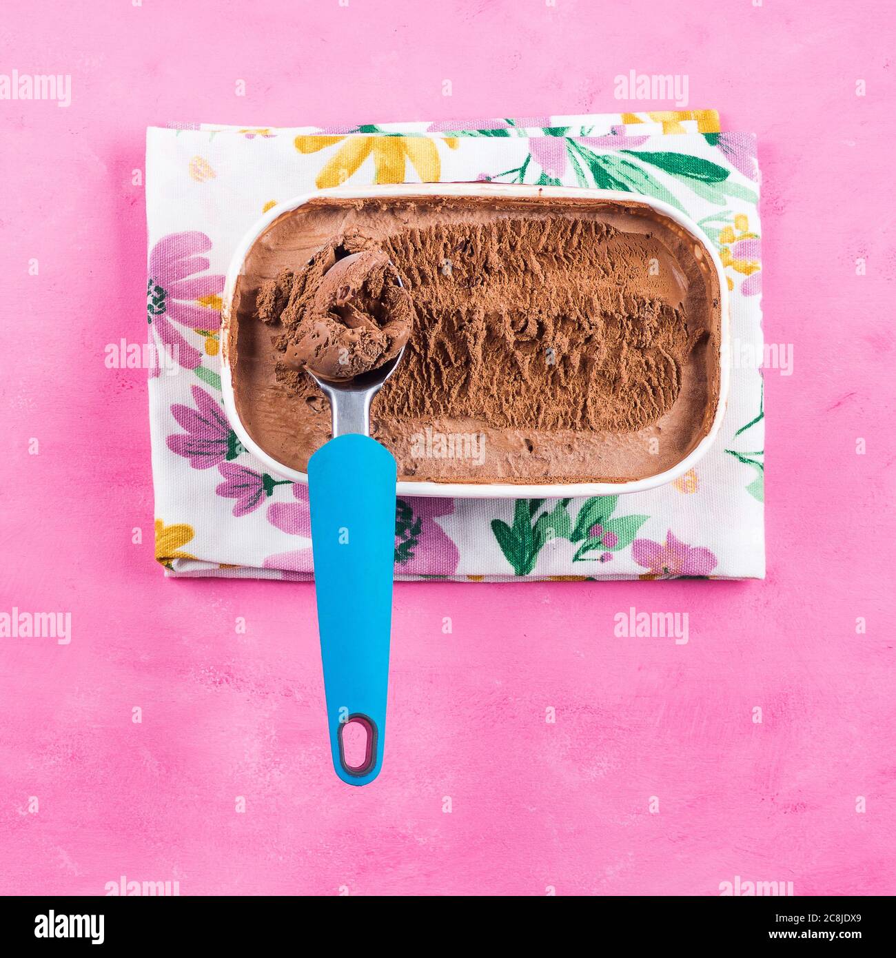 Empty tub of chocolate ice-cream with a plastic spoon Stock Photo - Alamy