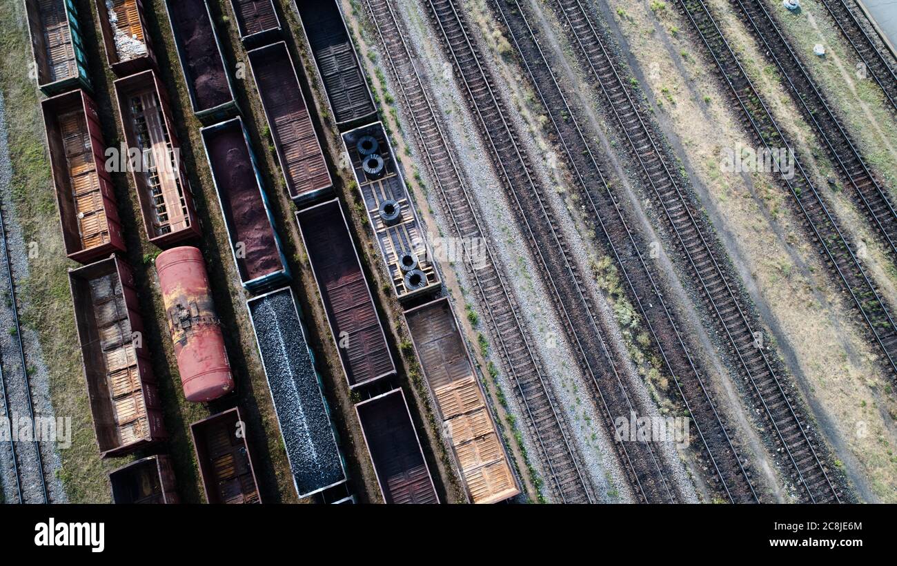 Aerial view of rail sorting freight station with railway cars, with